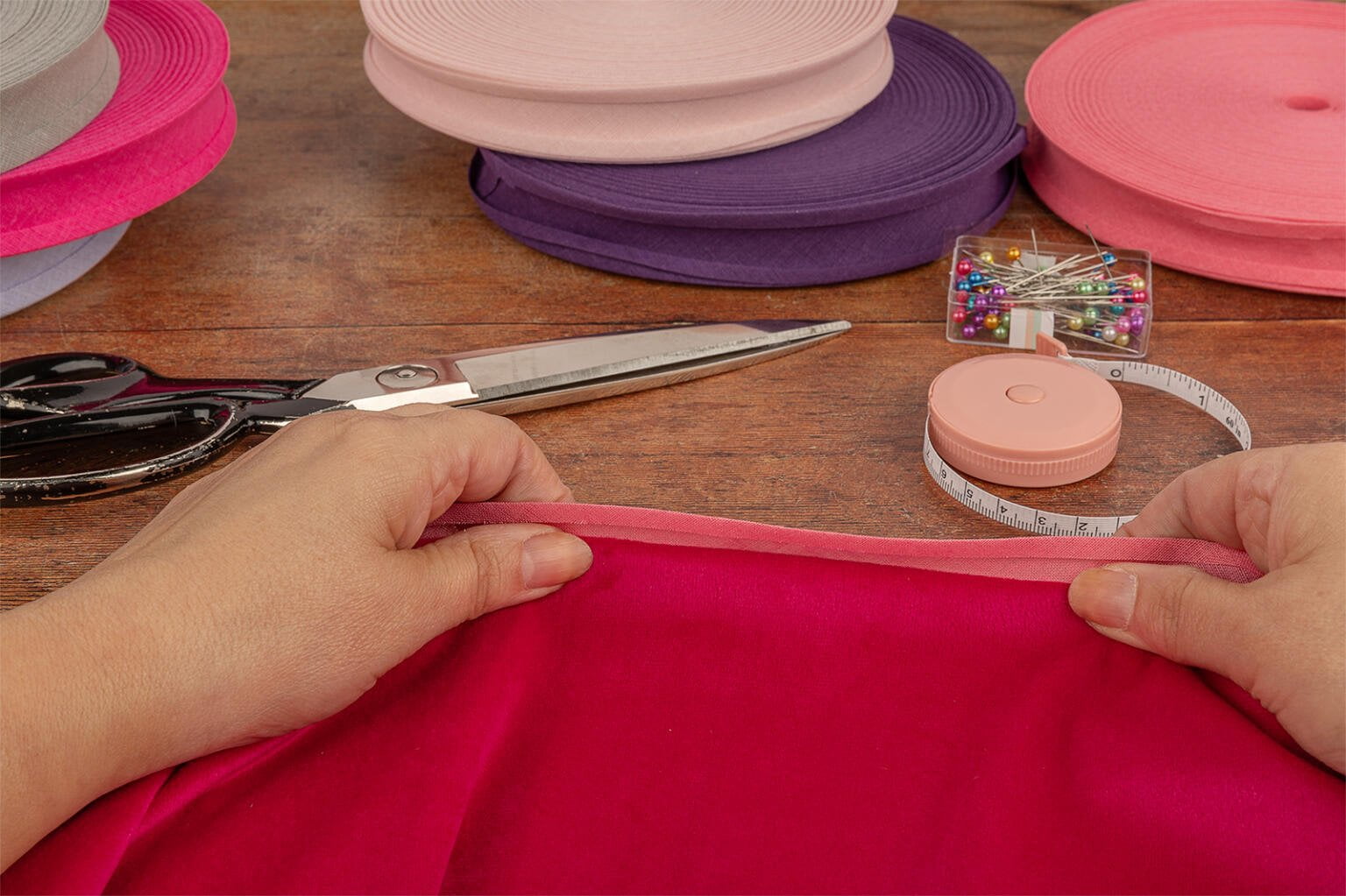 application of bias binding tape with bias binding reels in background