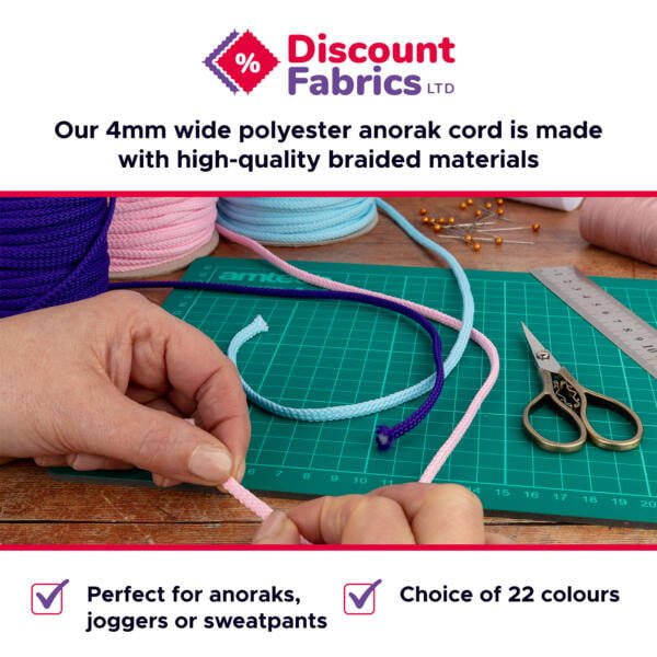 A pair of hands holding a pink cord with more cords in blue and purple colors on a cutting mat. The text above reads, "Discount Fabrics LTD," and below that, "Our 4mm wide polyester anorak cord is made with high-quality braided materials." Text at the bottom indicates, "Perfect for anoraks, joggers or sweatpants" and "Choice of 22 colours.