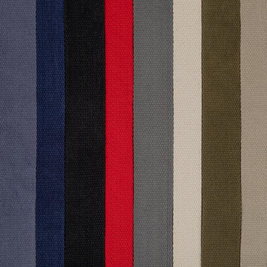 Vertical stripes of various colors, including shades of gray, blue, black, red, light beige, and olive green, aligned closely together. This pattern appears on a textured fabric surface.