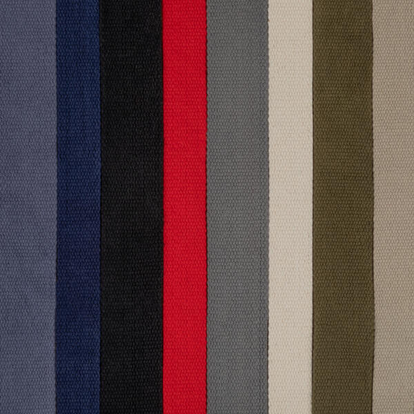 Vertical stripes of various colors, including shades of gray, blue, black, red, light beige, and olive green, aligned closely together. This pattern appears on a textured fabric surface.