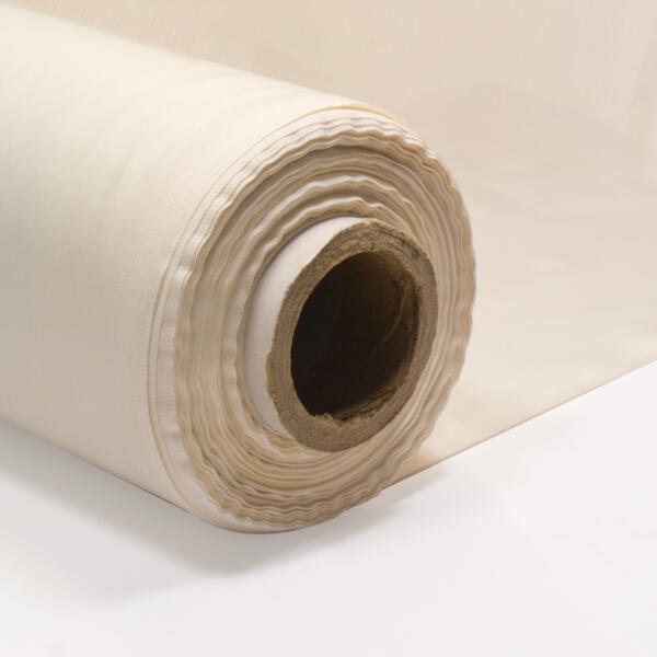 A close-up of a large roll of off-white fabric, rolled around a cylindrical cardboard core. The fabric appears smooth and neatly aligned, and part of the fabric is unrolled and laid out flat behind the roll. The background is white.