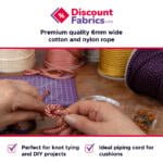 A person's hands tying a knot with pink and purple rope on a crafting mat. Nearby are spools of rope, a tape measure, and pins. Text at the top reads "Discount Fabrics LTD" and "Premium quality 6mm wide cotton and nylon rope." Text at the bottom highlights uses for knot tying and DIY projects, and as piping cord for cushions.