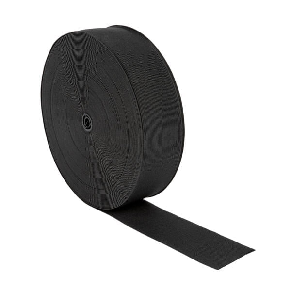 A large roll of black elastic band is placed against a white background. The band is unrolling slightly, showing its texture and width.