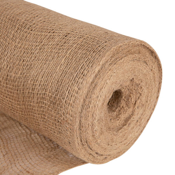 A close-up image of a large roll of burlap fabric, partially unrolled. The fabric has a coarse, open weave texture and is brown in color. The end of the roll is visible, showing the thickness and layers of the material.