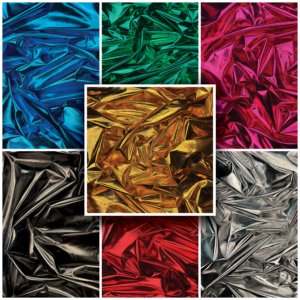 A collage of shiny, crumpled Metallic Foil Finish Jersey Fabric in various colors including blue, green, red, gold, black, and silver. Arranged in a grid with one larger central square featuring the gold foil fabric surrounded by six smaller squares in different colors. It resembles an abstract jersey of dazzling hues.