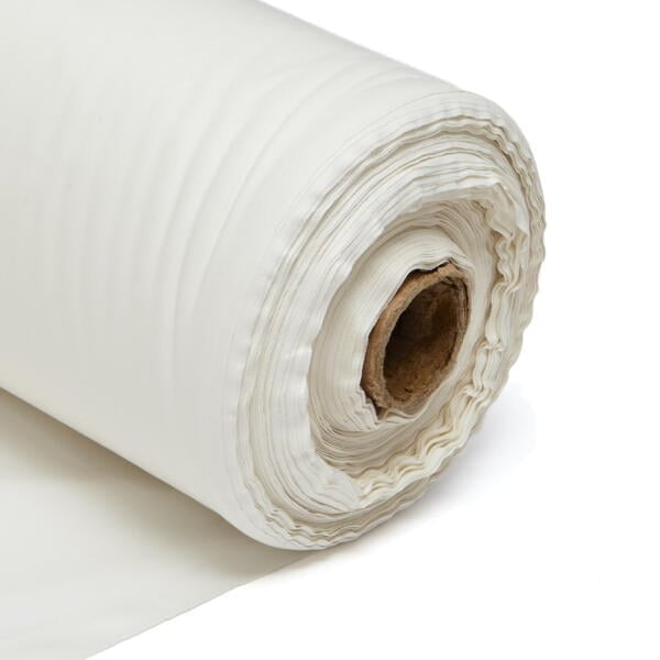 A close-up of a large roll of white fabric, partially unrolled. The fabric appears smooth and thick with slightly crimped edges. The core of the roll is visible, made of brown cardboard. The image is set against a plain, white background.
