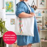 Calico fabric being used with a real life example of use case. White Cotton tote bag