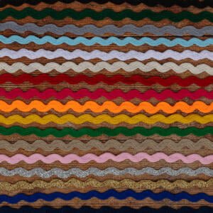 A colorful textile pattern with horizontal, wavy stripes in various colors, including brown, green, blue, yellow, orange, red, and pink. The stripes have a textured appearance, giving the fabric a dynamic and visually interesting look.