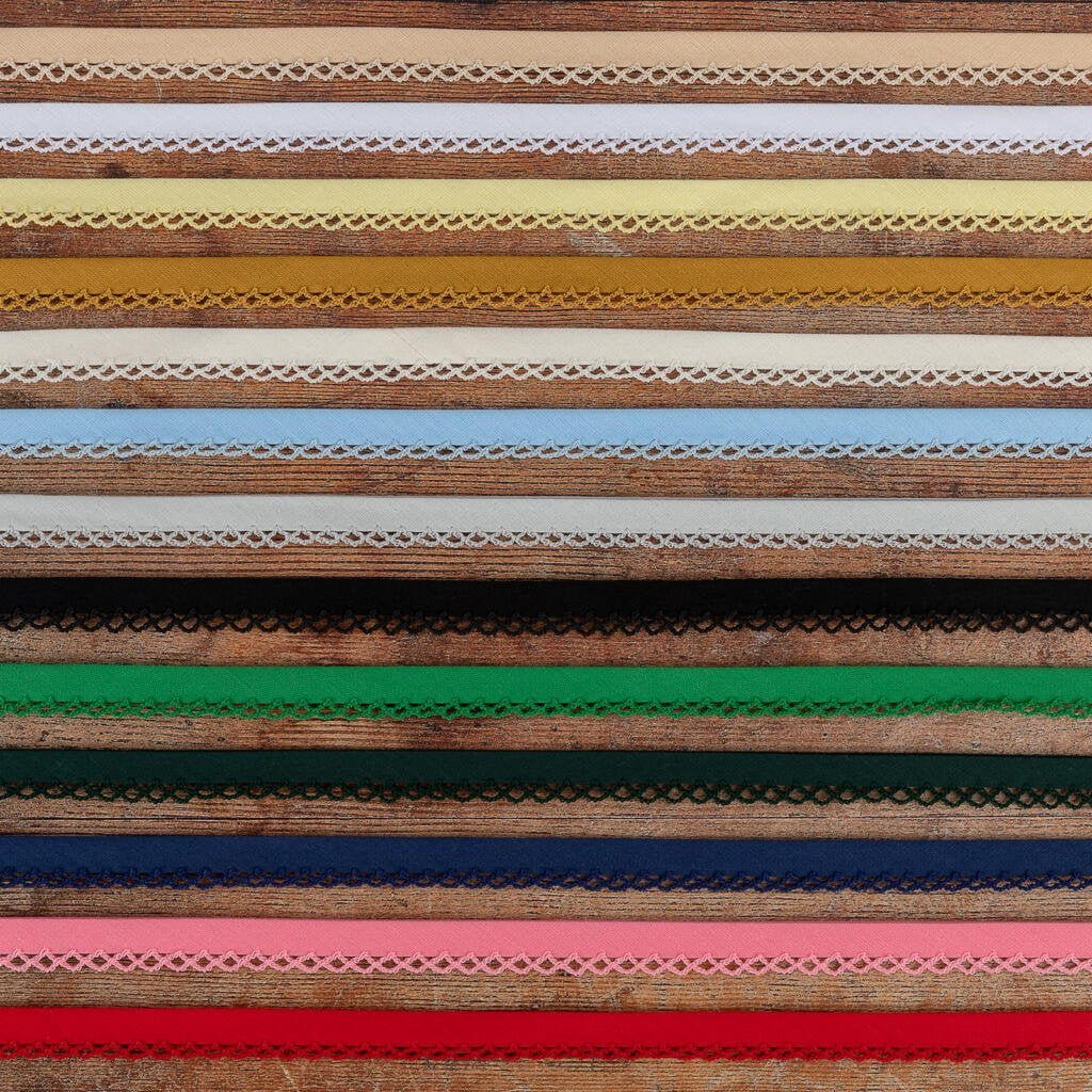 A collection of various colorful lace trims arranged in horizontal rows. The laces are in shades of brown, yellow, green, blue, pink, and other colors, each featuring intricate patterns and designs.