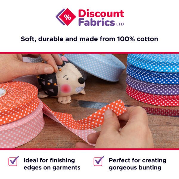 A close-up image of hands holding a strip of orange polka dot fabric from a roll, with multiple rolls of polka dot fabric in various colors on a wooden table. The text advertises "Discount Fabrics LTD" and highlights the fabric being 100% cotton.