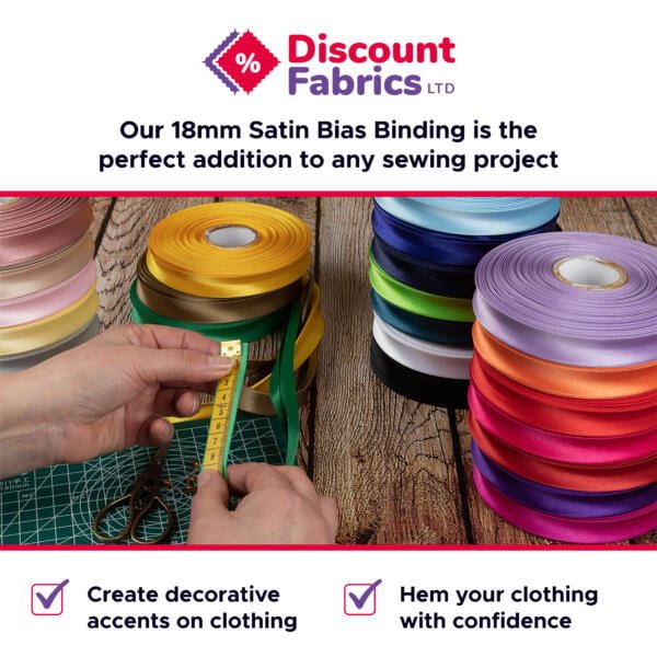 An assortment of colorful satin bias binding rolls are displayed. A person measures green bias tape with a measuring tape on a cutting mat. Text above reads, "Discount Fabrics LTD. Our 18mm Satin Bias Binding is the perfect addition to any sewing project.