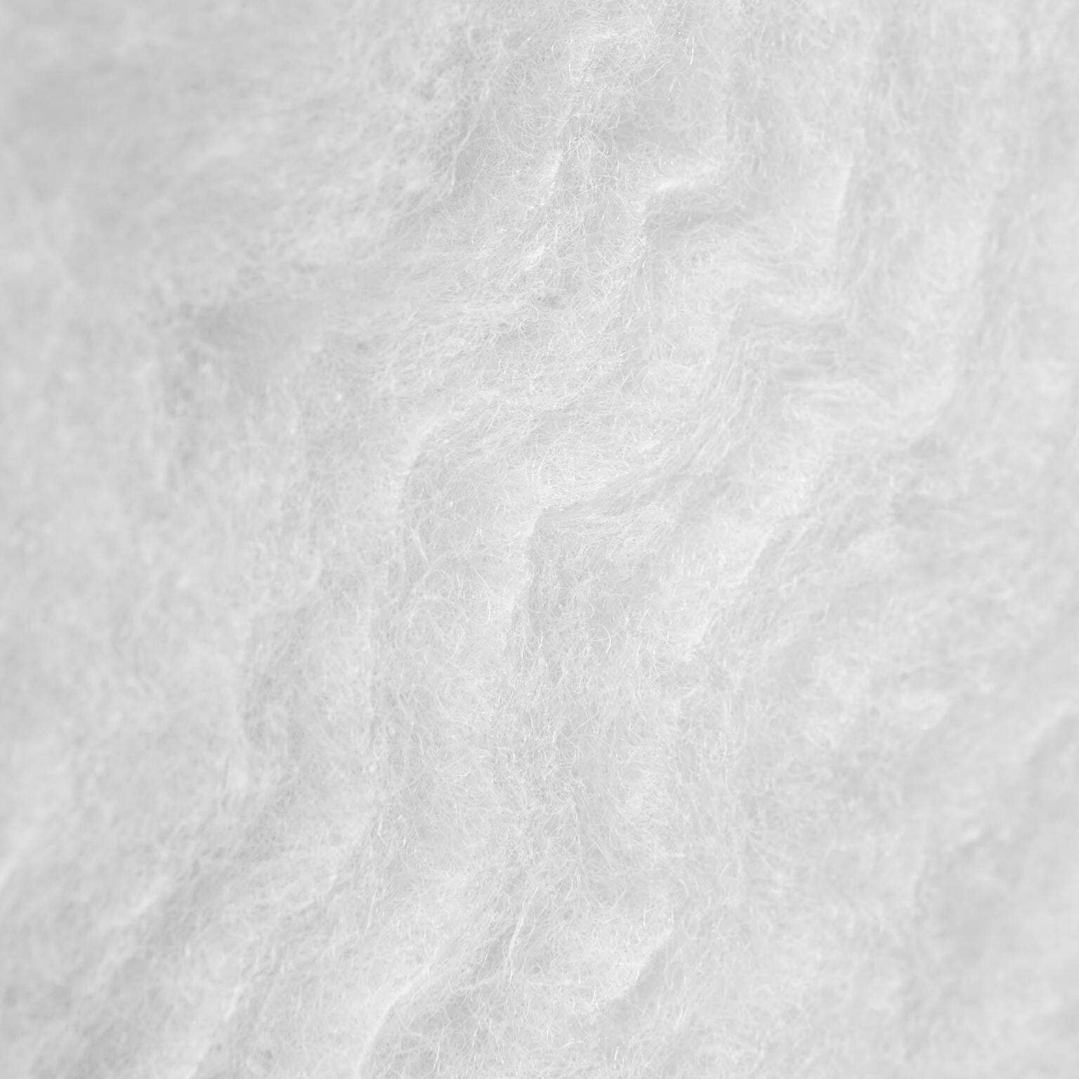 Close-up image of a textured, white fibrous material, showing a soft, fluffy surface with irregular, wavy patterns. The overall appearance resembles wool or cotton.