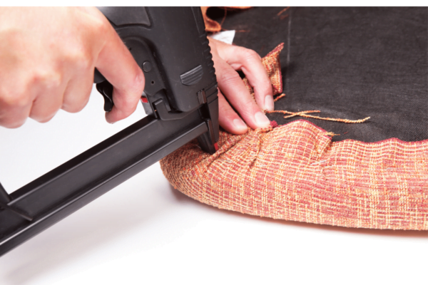 image showing how to easily reupholster old furniture using a staple gun