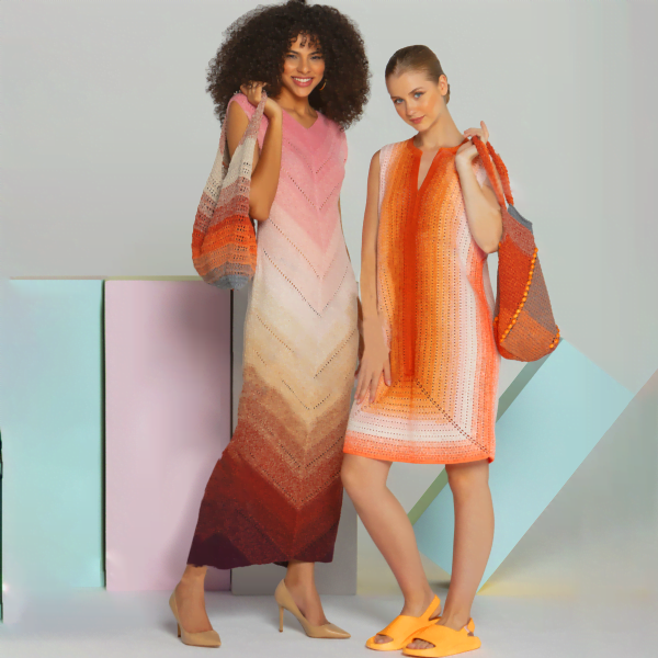 Two models pose in crochet dresses. The model on the left wears a long, multicolored dress with pink and orange hues and carries a matching shoulder bag. The model on the right wears a similarly styled sleeveless mini dress with orange and white tones and carries an orange bag.