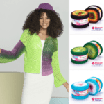 A smiling woman with curly hair wears a gradient crocheted cardigan and a purple hat. To the right, three colorful yarn spools in orange-black, green, and blue-pink are displayed, each labeled "Yarn Art" and featuring the "Discount Fabrics" logo.
