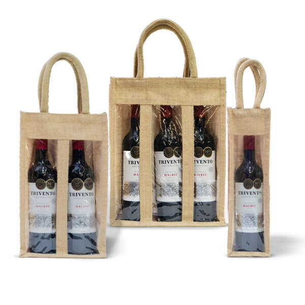 Three jute wine bags containing Import placeholder for HSNWBG_WND. The bags have clear plastic windows on the front, showcasing one, two, and three bottles respectively. Each bag has sturdy jute handles on top. The bottles feature a white label with red and gold accents.