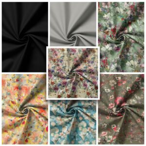 Six pieces of Rose and Hubble Cotton Lawn Fabric, each twisted at the center, arranged in a grid pattern. The top row features black, light gray, and floral patterns. The bottom row displays fabrics with fall leaves, colorful flowers, and dark floral prints. A smaller central swatch blends red and purple flowers.