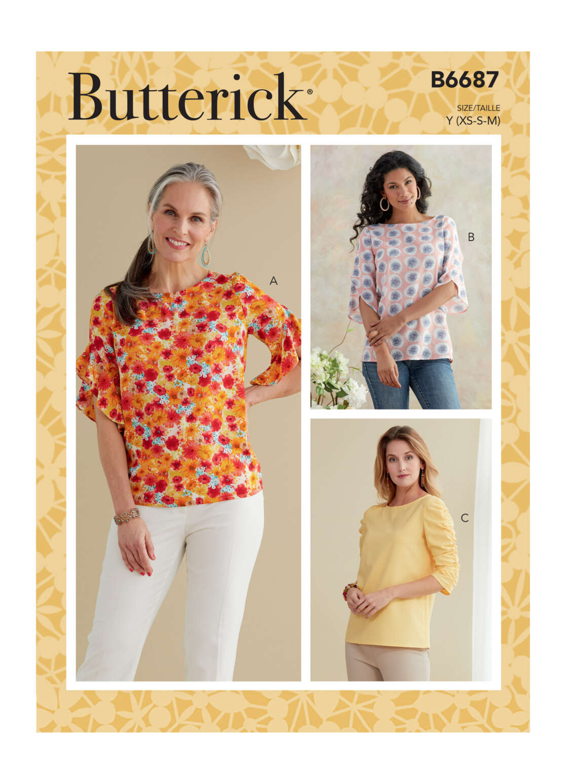 Butterick sewing pattern B6687 showcases three women's blouse designs. View A features a floral print top with ruffle sleeves, View B has a geometric print with wide sleeves, and View C presents a solid yellow top with gathered sleeves.
