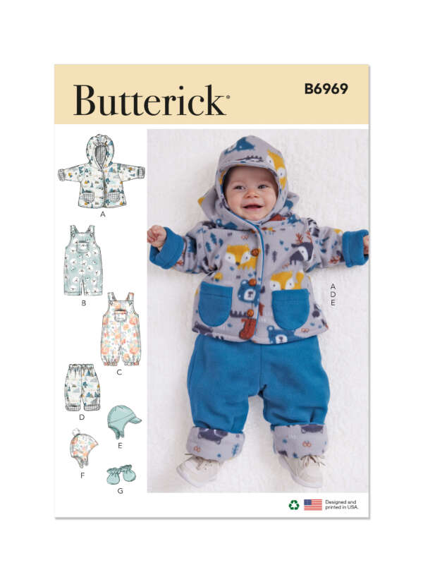 Pattern cover for Butterick B6969 featuring a baby in a blue coordinated outfit with a bear and forest print hoodie, and matching blue pants. The pattern includes designs for a hoodie, overalls, romper, hat, and stuffed toy.