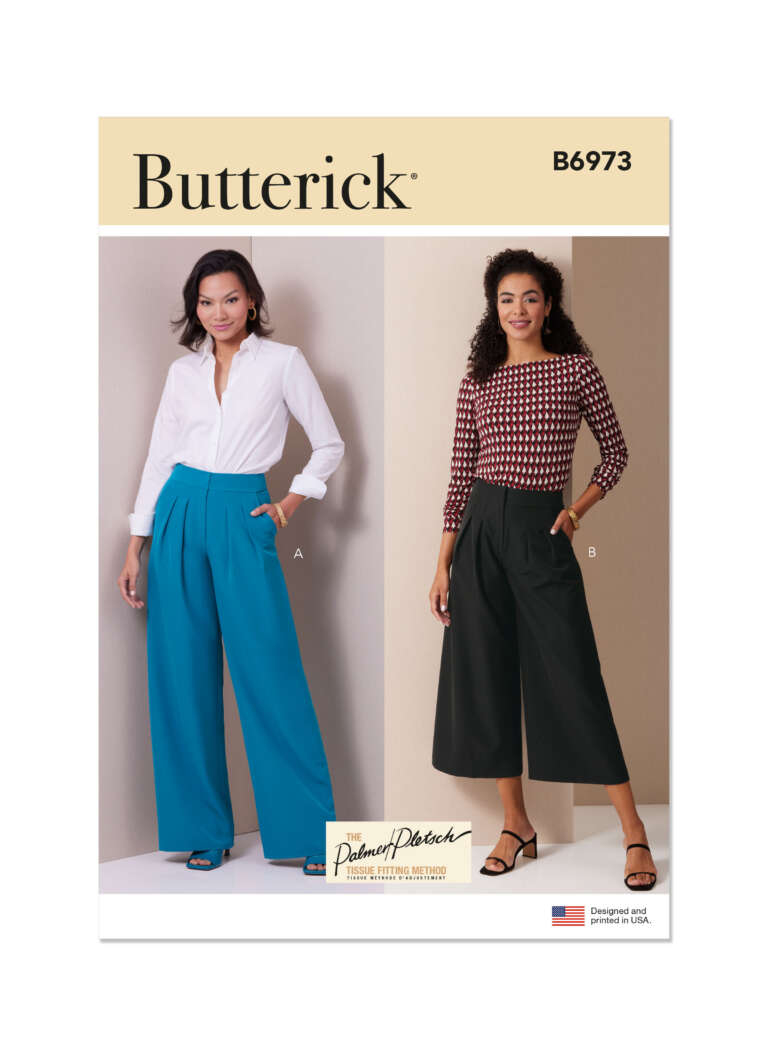 Butterick sewing pattern B6973 showcases two women's outfits. On the left, there's a woman wearing a white blouse and teal wide-legged pants. On the right, another woman wears a patterned blouse with three-quarter sleeves and black culottes.