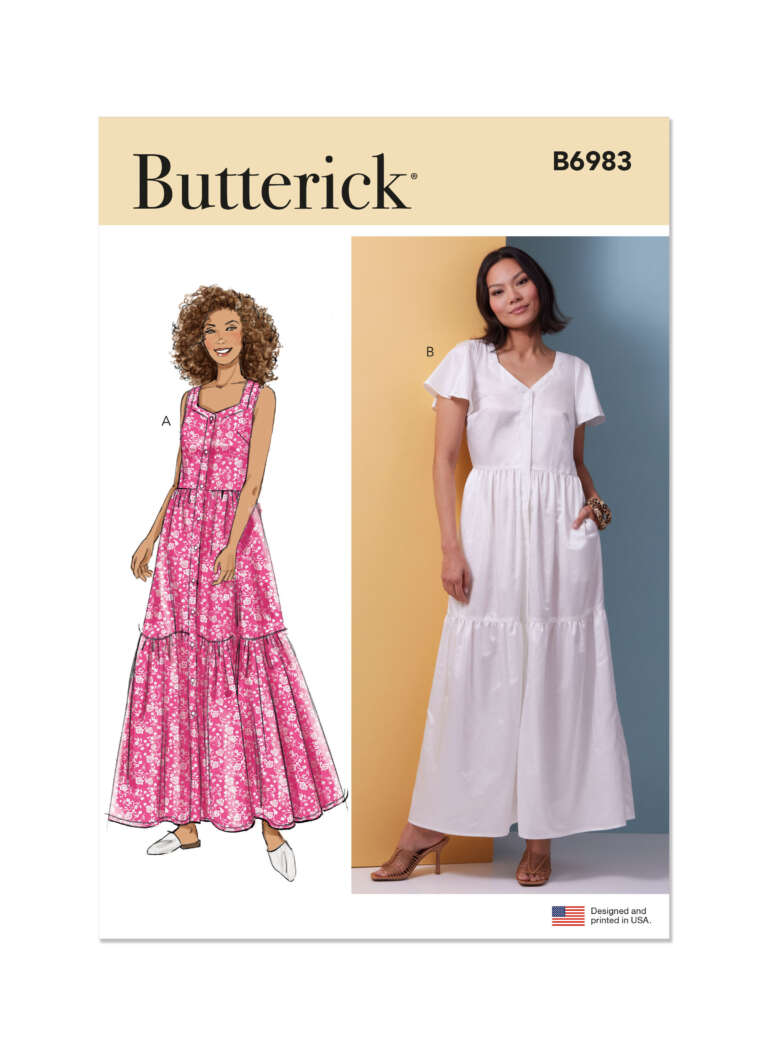 Butterick pattern B6983 envelope showing two dress designs. Design A illustrates a woman with curly hair wearing a sleeveless, tiered, pink floral dress. Design B shows a photo of a woman wearing a white, short-sleeved, tiered maxi dress.