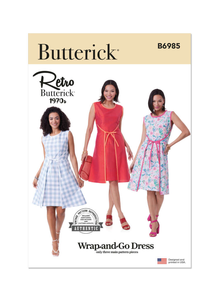 Sewing pattern cover for Butterick B6985, featuring three women modeling the "Wrap-and-Go Dress" in different fabrics: light blue plaid, solid red, and floral. Includes a "Retro Butterick 1970's" label and a stamp indicating a three-piece pattern.