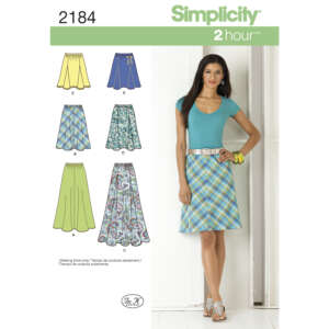 Simplicity sewing pattern 2184 includes instructions for five skirt styles. The cover features a woman wearing a plaid A-line skirt and a blue top. The pattern options appear in diagrams, showcasing different skirt designs and fabric choices.
