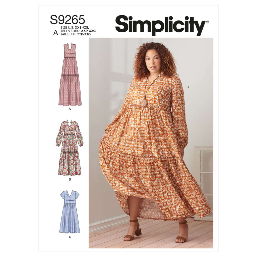 A pattern cover for Simplicity S9265 featuring a model wearing a long, flowing dress (option B) with long sleeves and a multi-colored floral print. The cover also shows illustrations of three other dress options (A, C, and D), each in different styles and fabric patterns.