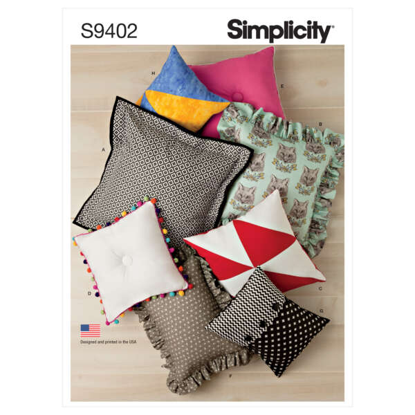 A variety of colorful pillows are displayed in a Simplicity sewing pattern S9402. The pillows feature different shapes, sizes, and patterns, including geometric designs, cat prints, ruffles, pom-poms, and various colors like pink, red, and blue.