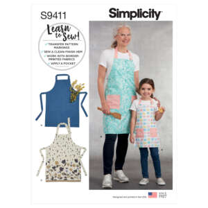 A Simplicity sewing pattern package (S9411) featuring two smiling individuals wearing handmade aprons. The main image showcases a woman in a turquoise apron and a child in a pastel apron. Three additional apron designs (A, B, C) are displayed on the side.