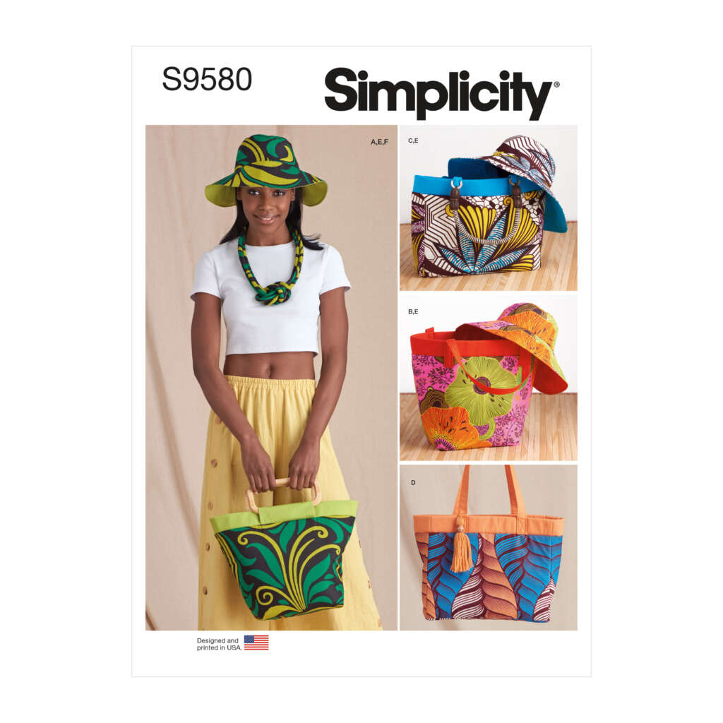 Cover of Simplicity pattern S9580 showing a woman wearing a brightly patterned hat and scarf, holding a tote bag. To the right, there are images of different hats and bags made with vibrant, colorful prints. The "Designed and Printed in the USA" logo is at the bottom left.