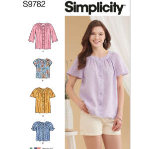 A sewing pattern envelope for Simplicity S9782. It features a woman wearing a light purple button-up blouse with short sleeves and light-colored shorts. To her left are illustrations of various blouse styles labeled A, B, C, and D in different colors and patterns.