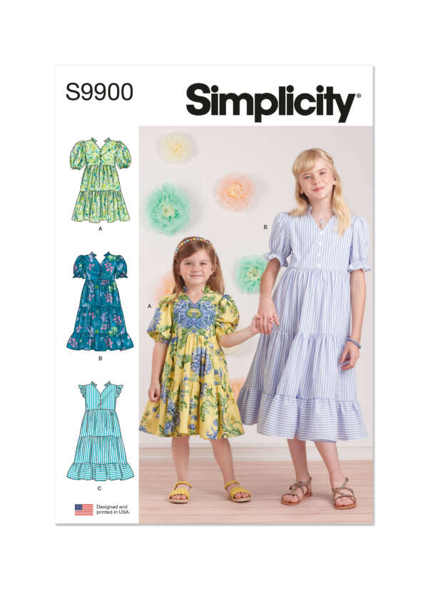 A Simplicity dress pattern packet (S9900) with a photo of two girls wearing dresses. The smaller girl wears a yellow floral dress, and the taller girl wears a blue and white striped dress. The packet also shows illustrations of two other dress designs.