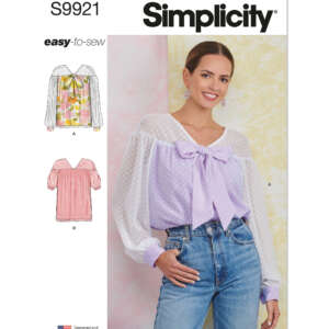 Pattern cover for Simplicity S9921 showcasing a woman wearing a sheer, light purple blouse with a large bow and high-waisted jeans. The cover also features illustrations of two blouse variations: view A (sheer with bow) and view B (solid with ruffle).