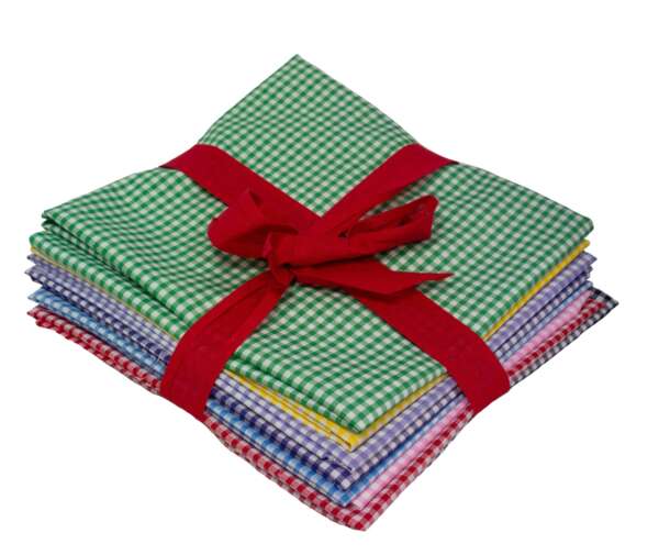 A stack of folded, colorful gingham fabric pieces tied with a red ribbon. The fabrics feature small checkered patterns in various colors, including green, blue, yellow, red, and purple. The red ribbon forms a neat bow on top of the stack.