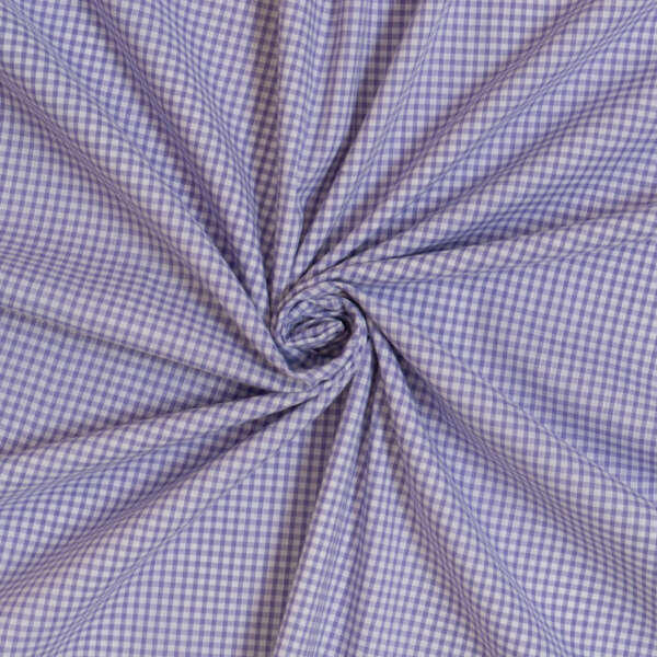 A close-up of a piece of fabric with a blue and white checkered pattern. The fabric is gathered and twisted at the center, creating a swirl effect and radiating folds around it. The texture and pattern are clearly visible.