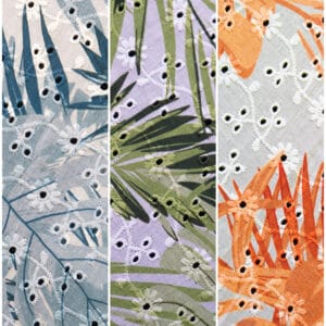 Three fabric panels with tropical leaf patterns and small embroidered flowers. The left panel has blue and gray leaves, the center has green leaves on lavender, and the right has orange leaves on light orange fabric.