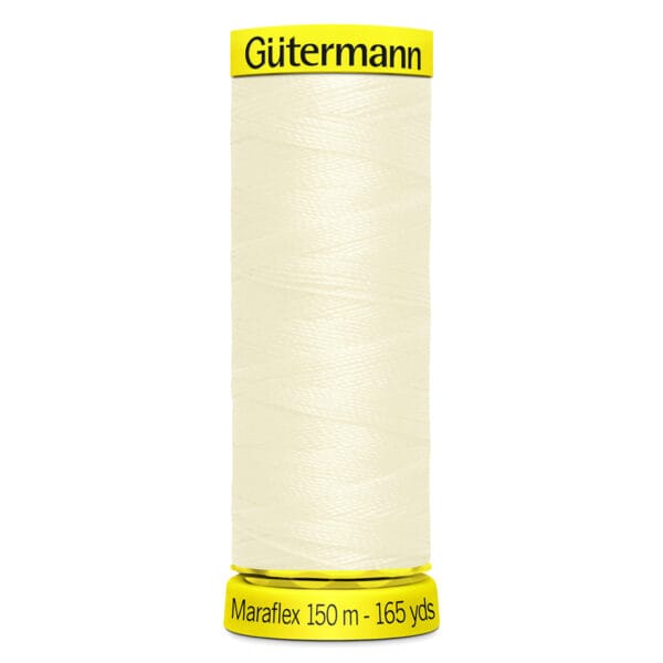 A spool of Gütermann Maraflex thread is shown. The thread is off-white and wrapped around a cylindrical spool. The labels on the top and bottom are yellow, displaying the brand name and length: 150 meters (165 yards).