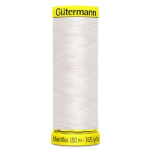 A spool of Gütermann Maraflex white thread, 150 meters (165 yards), with a yellow label.