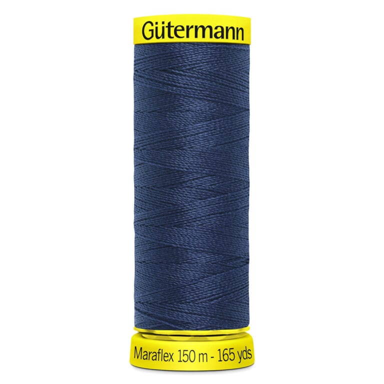 A spool of Gütermann Maraflex navy blue thread, labeled as 150 meters and 165 yards, with bright yellow ends displaying the brand and product details.