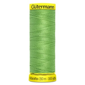Spool of Gütermann Maraflex green thread, 150 meters (165 yards) long, with yellow labels at top and bottom displaying the brand and length.