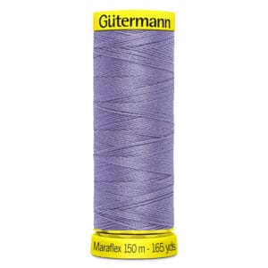 A spool of Gütermann Maraflex thread in a light purple color, with yellow labels at the top and bottom. The label states "150 m - 165 yds." The thread is neatly wound around the spool.