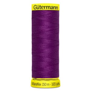 A spool of Gütermann Maraflex sewing thread in deep purple. The label indicates 150 meters or 165 yards of thread. The brand and measurements are printed in black on yellow at the top and bottom of the spool.
