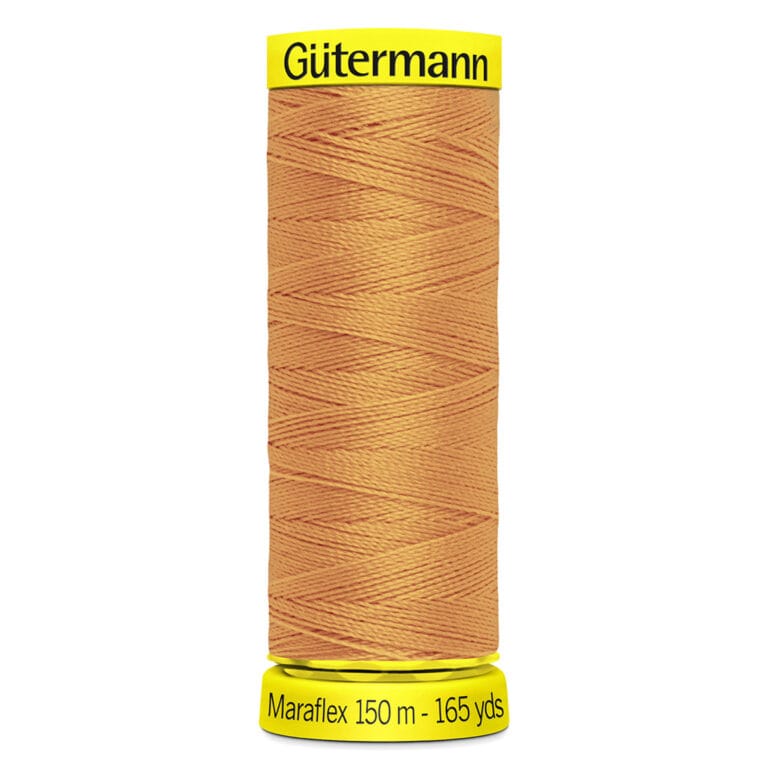 A spool of Gütermann Maraflex sewing thread, 150 meters (165 yards) long. The thread is a light brown color, and the spool has a label on top and bottom with the brand and product details.