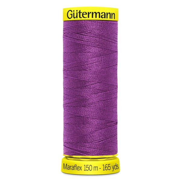 A purple spool of Gütermann Maraflex thread. The spool features a yellow cap and base, with text indicating it is 150 meters (165 yards) long.