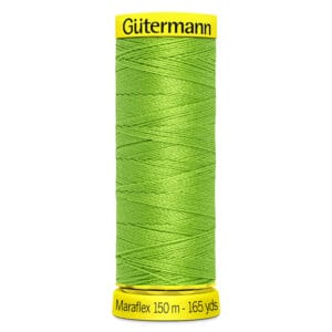A spool of Gütermann Maraflex sewing thread in bright green, labeled with "Maraflex 150 m - 165 yds" on the bottom and "Gütermann" on the top. The thread is tightly wound around the spool.