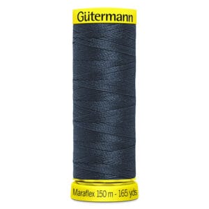 A spool of Gütermann Maraflex thread in dark blue. The spool has yellow labels at the top and bottom, with the text: "Gütermann" on the top label and "Maraflex 150 m - 165 yds" on the bottom label.