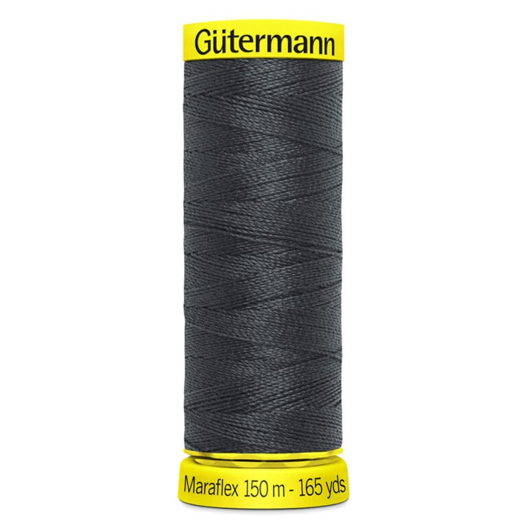 A spool of Gütermann Maraflex thread in dark gray, wrapped tightly. The top and bottom edges of the spool are yellow, with text indicating "Maraflex 150 m - 165 yds.