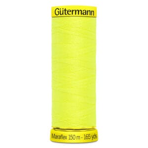A spool of Gütermann MaraFlex thread in bright yellow. The spool is labeled with "Gütermann" at the top and "Maraflex 150 m - 165 yds" at the bottom. The thread is neatly wound around the spool.