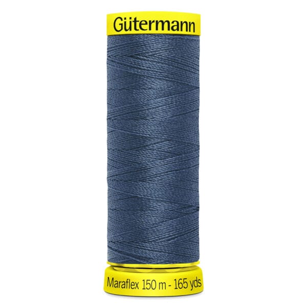 A spool of Gütermann Maraflex thread in dark blue, wrapped around a cylindrical holder. The top and bottom of the holder are bright yellow, with "Gütermann" on top and "Maraflex 150 m - 165 yds" on the bottom.